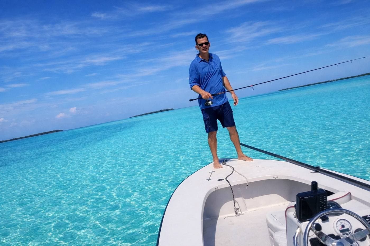 Captain Henry on the bow of his skiff